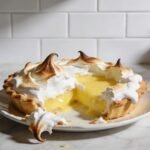 Glossy meringue dessert made with cream of tartar showing stable stiff peaks